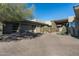 Home exterior showcasing a paved driveway and desert landscaping at 9374 E Andora Hills Dr, Scottsdale, AZ 85262