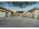 Modern home with expansive driveway and desert landscaping at 9374 E Andora Hills Dr, Scottsdale, AZ 85262