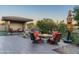 Cozy fire pit area with comfortable seating and desert landscaping at 9374 E Andora Hills Dr, Scottsdale, AZ 85262