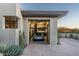 Modern garage with car lift and ample storage at 9374 E Andora Hills Dr, Scottsdale, AZ 85262