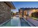 Stunning pool area with stone accents and a tranquil water feature at 9374 E Andora Hills Dr, Scottsdale, AZ 85262