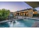 Inviting pool and patio area with stone accents and modern design at 9374 E Andora Hills Dr, Scottsdale, AZ 85262