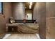 Modern powder room with marble vanity and dark brown wallcovering at 9374 E Andora Hills Dr, Scottsdale, AZ 85262