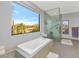 Luxurious bathroom with soaking tub and mountain views at 9570 E Via Montoya Dr, Scottsdale, AZ 85255