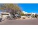 Beautiful stucco home with a large driveway and mature desert landscaping at 9570 E Via Montoya Dr, Scottsdale, AZ 85255