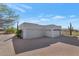 Two-car garage with brick paver driveway and desert landscaping at 9570 E Via Montoya Dr, Scottsdale, AZ 85255