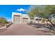 Two-car garage with brick paver driveway at 9570 E Via Montoya Dr, Scottsdale, AZ 85255