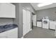 Laundry room with washer, dryer, and ample storage space at 9570 E Via Montoya Dr, Scottsdale, AZ 85255