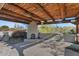 Desert home with outdoor fireplace and covered patio area at 9570 E Via Montoya Dr, Scottsdale, AZ 85255