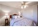 Bright bedroom with a queen-size bed and ceiling fan at 9621 N 94Th Dr, Peoria, AZ 85345