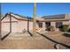 Single-story home with solar panels and a two-car garage at 9621 N 94Th Dr, Peoria, AZ 85345