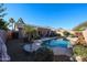 Inviting backyard oasis with a sparkling pool and desert landscaping at 9621 N 94Th Dr, Peoria, AZ 85345