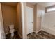 Bathroom with toilet, bathtub, and wood-look flooring at 102 S 83Rd Pl, Mesa, AZ 85208