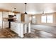 Open concept kitchen with white cabinets, granite counters and island at 102 S 83Rd Pl, Mesa, AZ 85208