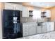 Modern kitchen with white cabinets, granite countertops, and stainless steel appliances at 102 S 83Rd Pl, Mesa, AZ 85208