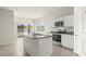 Modern kitchen with island, stainless steel appliances, and granite countertops at 109 S Collier Ln, Casa Grande, AZ 85122