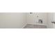 Bright laundry room with tile floor and hookups for washer and dryer at 109 S Collier Ln, Casa Grande, AZ 85122