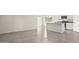 Open living room with tile flooring and access to the kitchen at 109 S Collier Ln, Casa Grande, AZ 85122