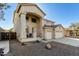 Two-story house with a three-car garage and desert landscaping at 12425 W Pima St, Avondale, AZ 85323