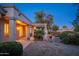 Landscaped backyard with pergola, lighting, and gravel at 15583 W Big Sky Dr, Surprise, AZ 85374