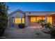Landscaped backyard with gravel and a stucco home at 15583 W Big Sky Dr, Surprise, AZ 85374