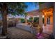 Evening view of backyard patio with pergola and lighting at 15583 W Big Sky Dr, Surprise, AZ 85374