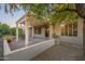 Landscaped backyard with a pergola and patio area at 15583 W Big Sky Dr, Surprise, AZ 85374