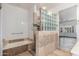 Bathroom with bathtub, shower, and tile flooring at 15583 W Big Sky Dr, Surprise, AZ 85374