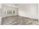 Spacious bedroom with wood floors and a large window at 15583 W Big Sky Dr, Surprise, AZ 85374