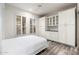 Bedroom with a Murphy bed and built-in cabinetry at 15583 W Big Sky Dr, Surprise, AZ 85374
