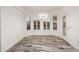 Bright breakfast nook with wood-look flooring and plantation shutters at 15583 W Big Sky Dr, Surprise, AZ 85374