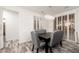 Bright dining area features table with gray upholstered chairs at 15583 W Big Sky Dr, Surprise, AZ 85374
