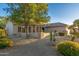 House with a landscaped yard, stone accents, and desert plants at 15583 W Big Sky Dr, Surprise, AZ 85374