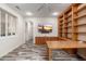 Spacious home office with built-in shelving and wood desk at 15583 W Big Sky Dr, Surprise, AZ 85374