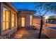 Back exterior of the house showing a patio and landscaping at 15583 W Big Sky Dr, Surprise, AZ 85374