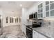 Modern kitchen with granite countertops and stainless steel appliances at 15583 W Big Sky Dr, Surprise, AZ 85374