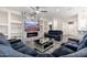 Bright living room with sectional sofa and built in shelving at 15583 W Big Sky Dr, Surprise, AZ 85374