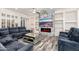 Relaxing living room with sectional sofa and modern fireplace at 15583 W Big Sky Dr, Surprise, AZ 85374