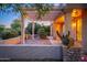 Brick patio under pergola with string lights and plants at 15583 W Big Sky Dr, Surprise, AZ 85374