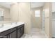 Clean bathroom with dual sinks and a walk-in shower at 19959 W Rancho Dr, Litchfield Park, AZ 85340
