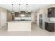 Modern kitchen with granite countertops and stainless steel appliances at 19959 W Rancho Dr, Litchfield Park, AZ 85340