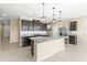 Modern kitchen with granite countertops and dark cabinetry at 19959 W Rancho Dr, Litchfield Park, AZ 85340