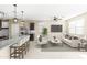 Open living room featuring comfortable seating and a large TV at 19959 W Rancho Dr, Litchfield Park, AZ 85340