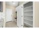 Spacious pantry with ample shelving for storage at 19959 W Rancho Dr, Litchfield Park, AZ 85340