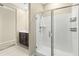 Modern shower with glass enclosure and built-in shelving at 19959 W Rancho Dr, Litchfield Park, AZ 85340