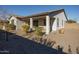 Relaxing backyard with covered patio and desert landscaping at 20487 W Minnezona Ave, Buckeye, AZ 85396