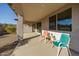 Relaxing covered patio with seating and desert views at 20487 W Minnezona Ave, Buckeye, AZ 85396