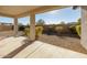 Spacious backyard patio with gravel and desert plants at 20487 W Minnezona Ave, Buckeye, AZ 85396