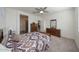 Bright bedroom with ceiling fan and ensuite access at 20487 W Minnezona Ave, Buckeye, AZ 85396