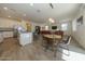 Kitchen and dining area with hardwood floors and modern lighting at 20487 W Minnezona Ave, Buckeye, AZ 85396